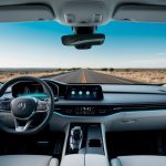 A sleek, futuristic car dashboard with high-tech gadgets and a digital interface, surrounded by a panoramic windshield showcasing a scenic, open road